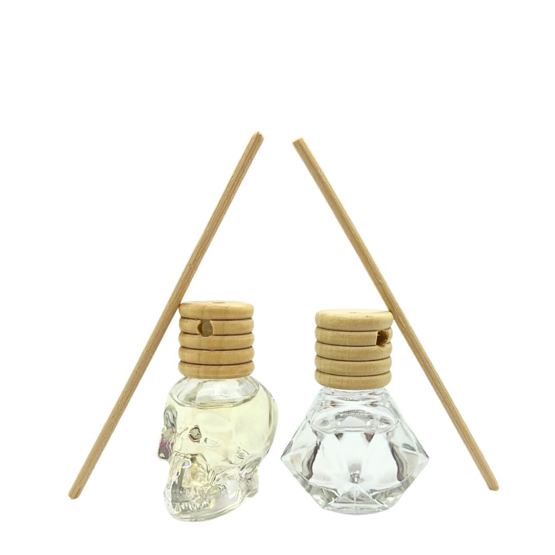 Mini diffusers smell rose in pyramid and skull bottles