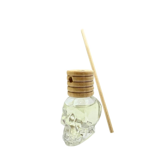 Small diffuser in skull bottle with Frangipani